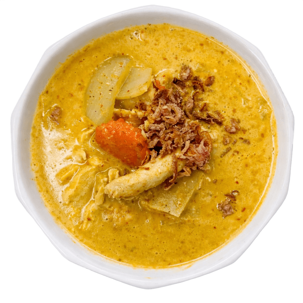 Creamy aromatic yellow curry sauce with potatoes, onion, carrot, and coconut milk; topped with fried shallot.